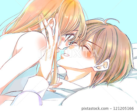 Male and female couple playing in bed, smiling, gazing, holding hands 121205166