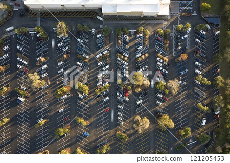 Top view of many cars parked on a parking lot in front of a shopping mall in Florida. Concept of urban transportation 121205453