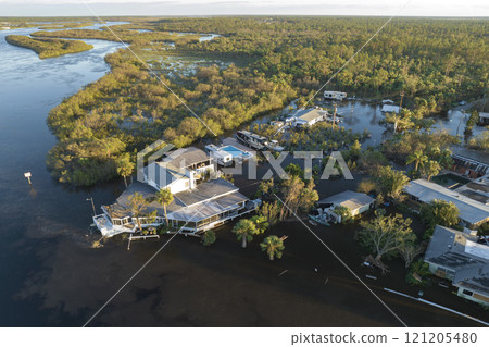 Surrounded by hurricane rainfall flood waters homes in Florida residential area. Aftermath of natural disaster 121205480
