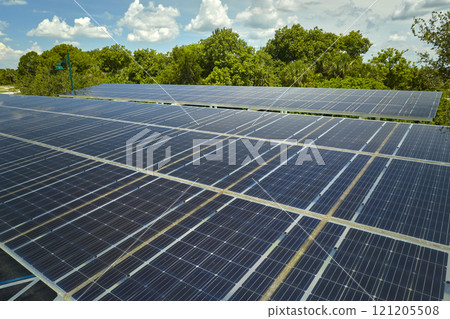 Solar panels installed over parking lot for parked cars for effective generation of clean energy 121205508