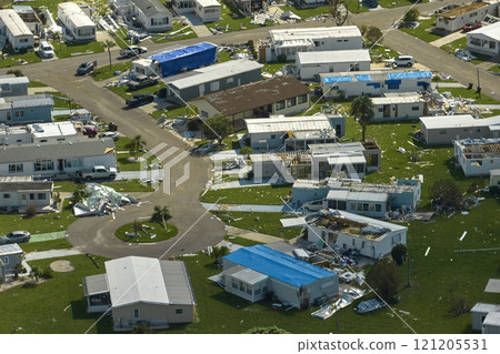 Severely damaged houses after hurricane Ian in Florida mobile home residential area. Consequences of natural disaster Severely damaged houses after hurricane Ian in Florida mobile home residential area. Consequences of natural disaster 121205531