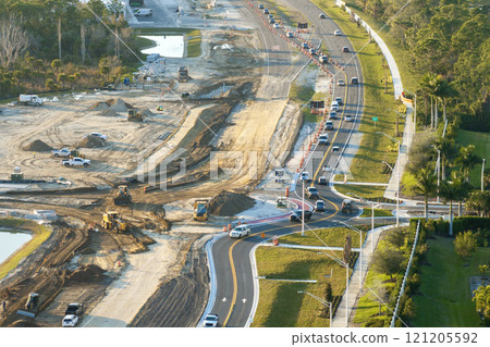 Roundabout construction roadworks on American transport infrastructure. Renovation of highway road with moving traffic. Development of interstate transportation concept Roundabout construction roadworks on American transport infrastructure. Renovation of highway road with moving traffic. Development of interstate transportation concept 121205592