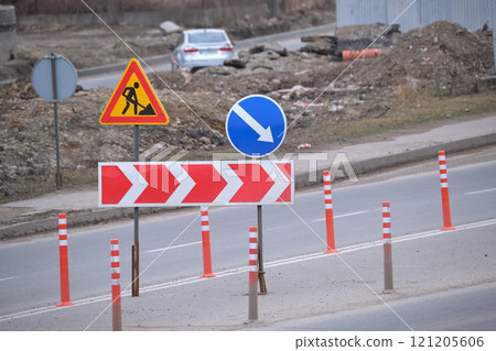 Roadworks warning traffic signs of construction work on city street 121205606