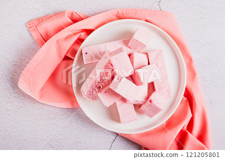 Close up of homemade dry berry yogurt on a plate on the table top view 121205801