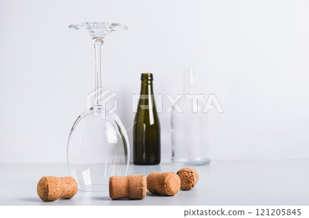 Alcohol abstinence, upside down wine glass among corks on table Alcohol abstinence, upside down wine glass among corks on table 121205845