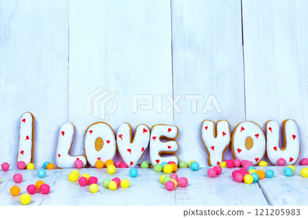 Homemade cookies in the form of a heart or I love you words as a gift to a beloved on Valentine's Day. Homemade cookies in the form of a heart or I love you words as a gift to a beloved on Valentine's Day. 121205983