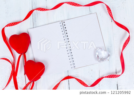 Valentines day toy hearts and notepad for your text. Top view on wooden table 121205992