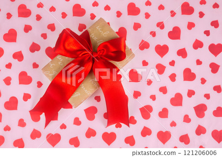 Valentine's Day. Presented as a red ribbon on a pink paper with red hearts 121206006