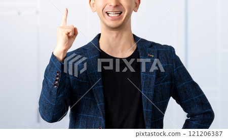 A male businessman pointing his index finger to guide you A male businessman pointing his index finger to guide you 121206387