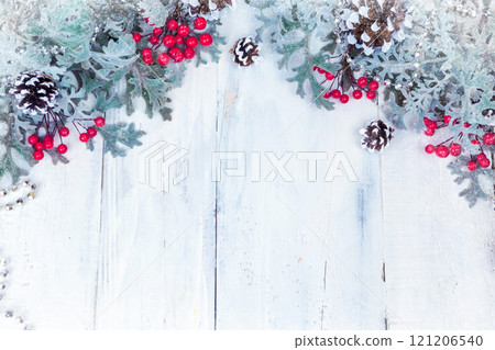 Christmas wooden background with snow branch. Top view with copy space for your text Christmas wooden background with snow branch. Top view with copy space for your text 121206540