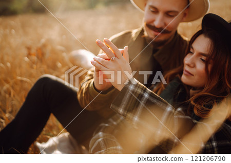 Lovely hipster couple enjoying each other in the autumn park. Nice autumn day. love and lifestyle. 121206790
