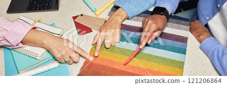 Website header shot of diverse team of designers choosing fabric among various color samples on tabletop while working together on new project in office, copy space Website header shot of diverse team of designers choosing fabric among various color samples on tabletop while working together on new project in office, copy space 121206864