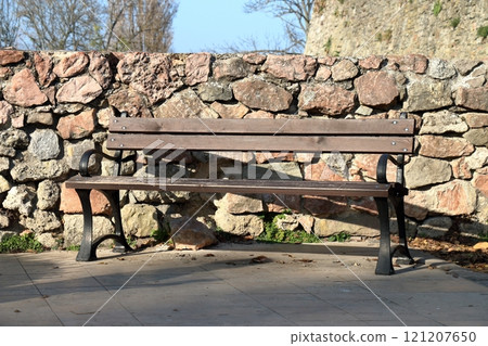 The outdoor wooden bench. The outdoor wooden bench. 121207650
