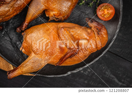 Delicious smoked quail meat on plate. top view 121208807