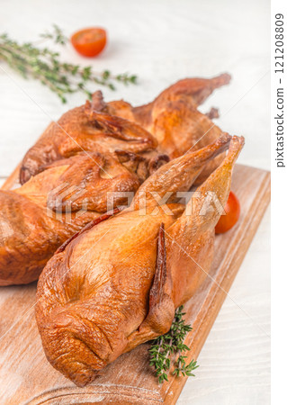 smoked quail, Delicious meat with spices and herbs. top view 121208809