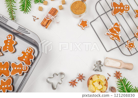 gingerbread Christmas cookies baking decorated with fir tree. Flour, brown sugar, eggs and spices. Bakery, Family Christmas concept top view gingerbread Christmas cookies baking decorated with fir tree. Flour, brown sugar, eggs and spices. Bakery, Family Christmas concept top view 121208830