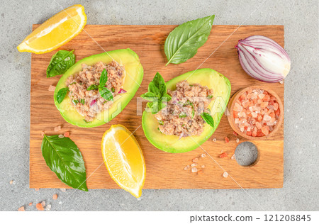 Tuna stuffed avocado. healthy and balanced eating. top view Tuna stuffed avocado. healthy and balanced eating. top view 121208845
