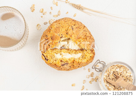 homemade gluten-free pastries oatmeal cookies with glass of latte on white background homemade gluten-free pastries oatmeal cookies with glass of latte on white background 121208875
