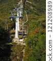 Cable car in the mountains on a background of blue sky. 121208989