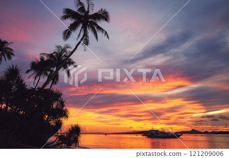 A picturesque sunset over the island of Culion in the Philippines. A picturesque sunset over the island of Culion in the Philippines. 121209006