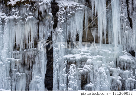 Natural icicles on a stone wall, Norway Natural icicles on a stone wall, Norway 121209032