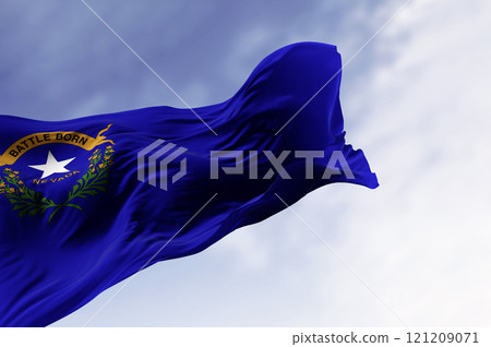 Nevada state flag waving in the wind on a clear day Nevada state flag waving in the wind on a clear day 121209071