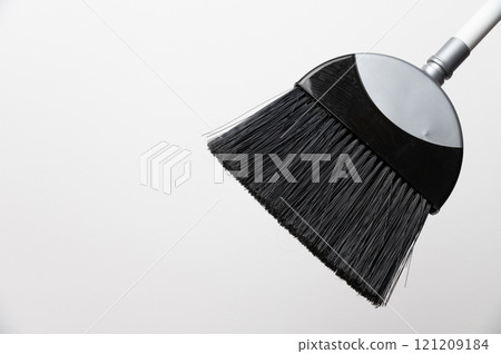 cropped view of floor broom handle on grey background, close-up of cleaning item cropped view of floor broom handle on grey background, close-up of cleaning item 121209184