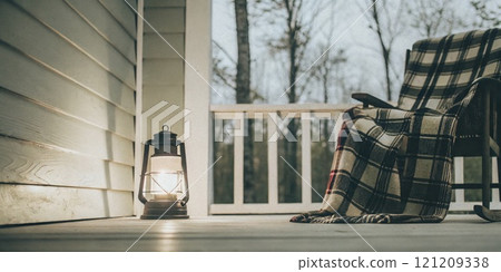 Rustic Porch with Lantern and Cozy Plaid Blanket on Rocking Chair 121209338