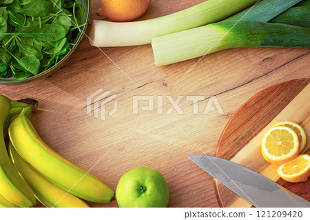 Fruits and vegetables for smoothies on a wooden background. Background with space for text  121209420