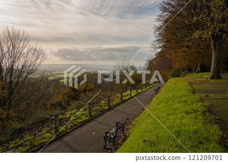 Park Walk in Shaftesbury, Dorset, UK. View of the English countryside with fields, trees, hills and a church. 121209701