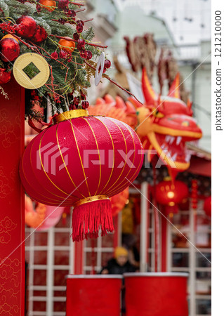 Colorful lanterns and dragon decorations adorn festive street during Chinese New Year celebration 121210000