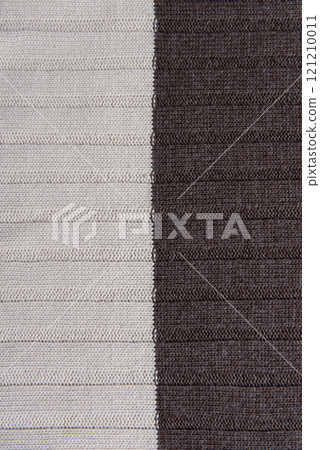 Texture of brown knitted fabric as background, top view. Texture of brown knitted fabric as background, top view. 121210011