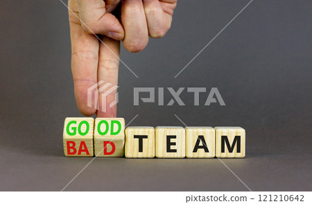 Good or bad team symbol. Concept words Good team Bad team on wooden cubes. Beautiful grey table grey background. Businessman hand. Business and good or bad team concept. Copy space. 121210642
