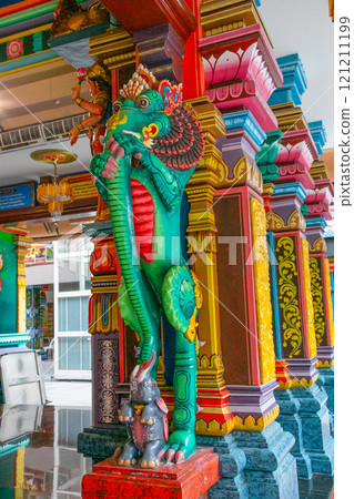 traditional small buddhist temple in kuala lumpur with many figures on facade 121211199