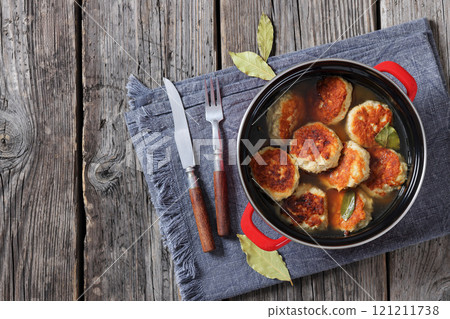 turkey potato cakes in a red pot, top view 121211738