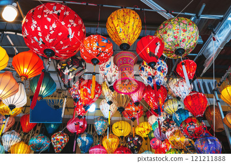 colorful Vietnamese hanging silk lanterns in Vietnam in Asia in the old town on the streets of Hoi An city at night 121211888