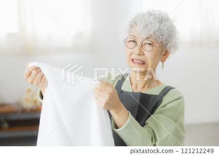 Senior woman doing housework 121212249
