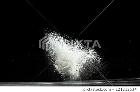 Baking soda powder explode in mid air. Powder of baking soda flying like explosion splashing, prepare to clean food vegetable as sodium bicarbonate carbonate, black background isolated Baking soda powder explode in mid air. Powder of baking soda flying like explosion splashing, prepare to clean food vegetable as sodium bicarbonate carbonate, black background isolated 121212534