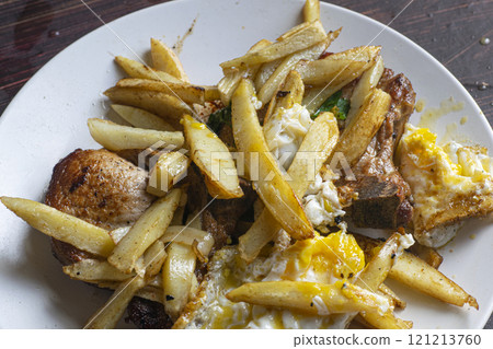 Pork chops fried with fried potato Pork chops fried with fried potato 121213760