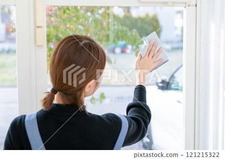 Woman cleaning windows Woman cleaning windows 121215322