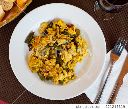 Scrambled eggs served with ham for breakfast Scrambled eggs served with ham for breakfast 121215819