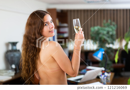 Portrait of bare body girl posing near the table in office Portrait of bare body girl posing near the table in office 121216069