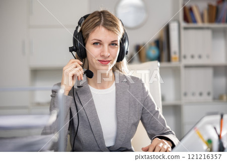Portrait of woman call center worker in office 121216357