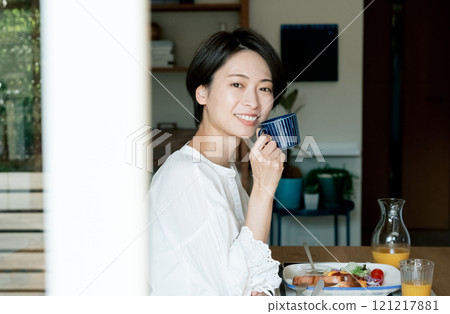 A woman drinking coffee 121217881