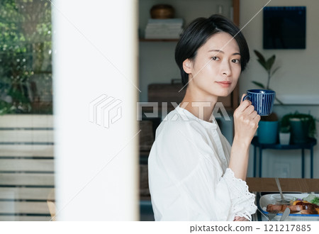 A woman drinking coffee 121217885