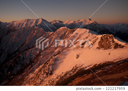 The Northern Alps ridgeline at sunrise 121217959