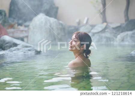 A young woman relaxing in an open-air bath. Photo courtesy of Shiratama no Yu Izumi Kei A young woman relaxing in an open-air bath. Photo courtesy of Shiratama no Yu Izumi Kei 121218614