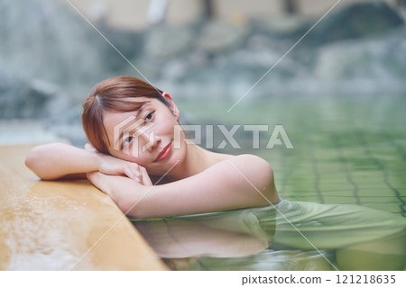 A young woman relaxing in an open-air bath. Photo courtesy of Shiratama no Yu Izumi Kei A young woman relaxing in an open-air bath. Photo courtesy of Shiratama no Yu Izumi Kei 121218635