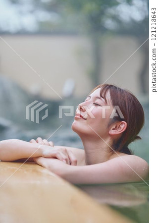 A young woman relaxing in an open-air bath. Photo courtesy of Shiratama no Yu Izumi Kei A young woman relaxing in an open-air bath. Photo courtesy of Shiratama no Yu Izumi Kei 121218643