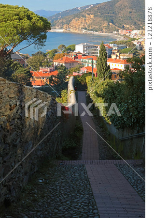 Stone path that follows sea from mountain to center of old town of Sestri Levante. Hiking in mountains. Sport and health.  121218878